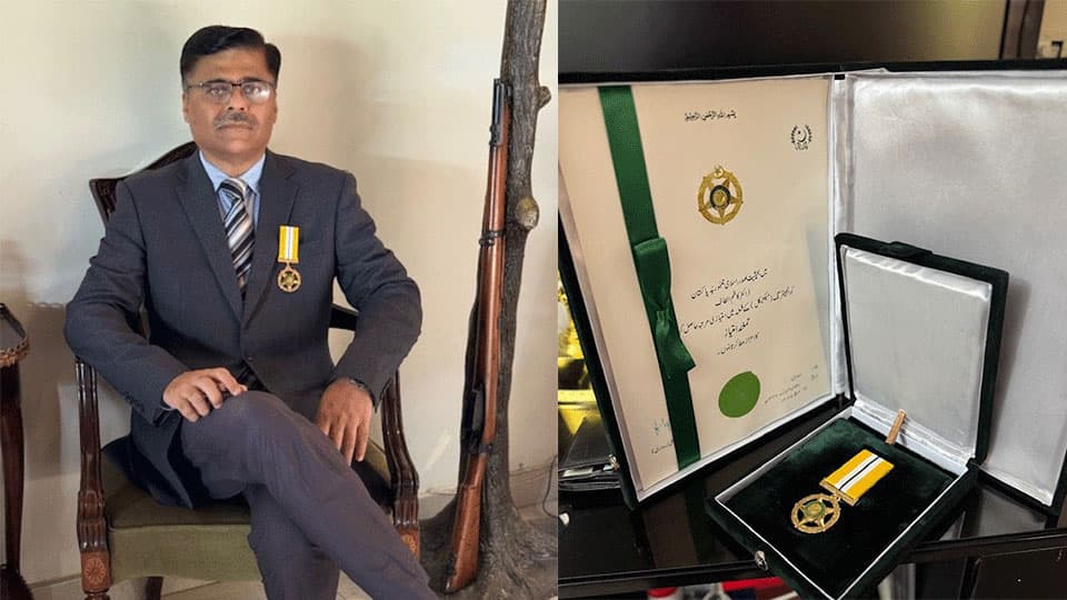 Kazim is wearing a navy suit and sitting down wearing the medal on one half of the image and on the right there is a close up of the medal.
